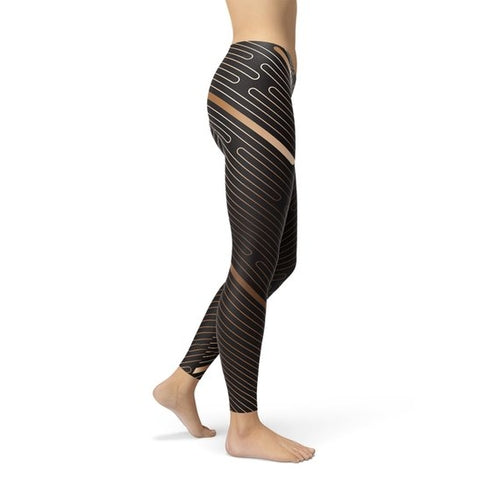 Black athletic striped line leggings for women with unique line patterns and mesh detailing